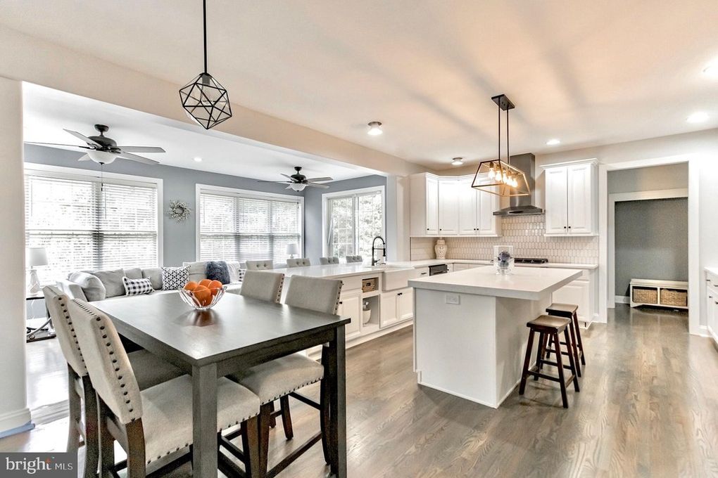 Open concept kitchen with island and pendant lighting