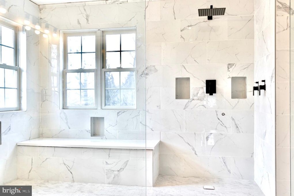 Modern bathroom with walk-in shower and large format tile